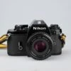 Nikon EM 35mm Film SLR Camera W/ 50mm F1.8 Lens And 'ever-ready' Case(Nikon Em 35mm Film Slr Camera W 50mm F1 8 Lens And Ever Ready Case)