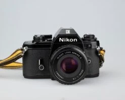 Nikon EM 35mm Film SLR Camera W/ 50mm F1.8 Lens And 'ever-ready' Case(Nikon Em 35mm Film Slr Camera W 50mm F1 8 Lens And Ever Ready Case)