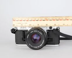 Canon® Canon AE-1 35mm SLR W/ Canon FD 50mm F1.8 Lens + Speedlite 188A Flash + Original Manual (serial 2388361)(Canon Ae 1 35mm Slr W Canon Fd 50mm F1 8 Lens Speedlite 188a Flash Original Manual Serial 2388361) -Vintage Camera Store canon AE 1 35mm film SLR camera serial 2388361 20240109 496