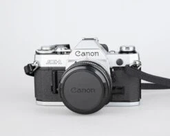 Canon® Canon AE-1 35mm SLR W/ Canon FD 50mm F1.8 Lens + Speedlite 188A Flash + Original Manual (serial 2388361)(Canon Ae 1 35mm Slr W Canon Fd 50mm F1 8 Lens Speedlite 188a Flash Original Manual Serial 2388361) -Vintage Camera Store canon AE 1 35mm film SLR camera serial 2388361 20240109 497