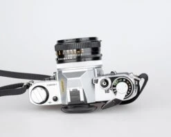 Canon® Canon AE-1 35mm SLR W/ Canon FD 50mm F1.8 Lens + Speedlite 188A Flash + Original Manual (serial 2388361)(Canon Ae 1 35mm Slr W Canon Fd 50mm F1 8 Lens Speedlite 188a Flash Original Manual Serial 2388361) -Vintage Camera Store canon AE 1 35mm film SLR camera serial 2388361 20240109 500