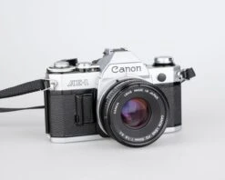 Canon® Canon AE-1 35mm SLR W/ Canon FD 50mm F1.8 Lens + Speedlite 188A Flash + Original Manual (serial 2388361)(Canon Ae 1 35mm Slr W Canon Fd 50mm F1 8 Lens Speedlite 188a Flash Original Manual Serial 2388361) -Vintage Camera Store canon AE 1 35mm film SLR camera serial 2388361 20240109 502