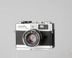 Minolta Hi-Matic 7SII 35mm Rangefinder Camera With Half-case And Minolta 20 Flash(Minolta Hi Matic 7sii 35mm Rangerfinder Camera With Half Case And Flash) -Vintage Camera Store minolta hi matic 7sii outftit with flash 202207031219