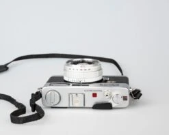 Minolta Hi-Matic E Compact 35mm Rangefinder Camera Feat. 40mm F1.7 Rokkor Lens (serial 328710)(Minolta Hi Matic E Compact 35mm Rangefinder Camera Feat 40mm F1 7 Rokkor Lens Serial 328710) -Vintage Camera Store minolta hi matic E 35mm rangefinder camera serial 328710 202304213779