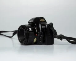 Minolta Dynax 3000i 35mm SLR W/ Minolta AF 50mm F1.7 Lens + Program D 314i Flash (serial 62301669))(Minolta Dynax 3000i 35mm Slr W Minolta Af 50mm F1 7 Lens Program D 314i Flash Serial 62301669) -Vintage Camera Store minolta maxxum 3000i film SLR camera serial 62301669 20250811 8